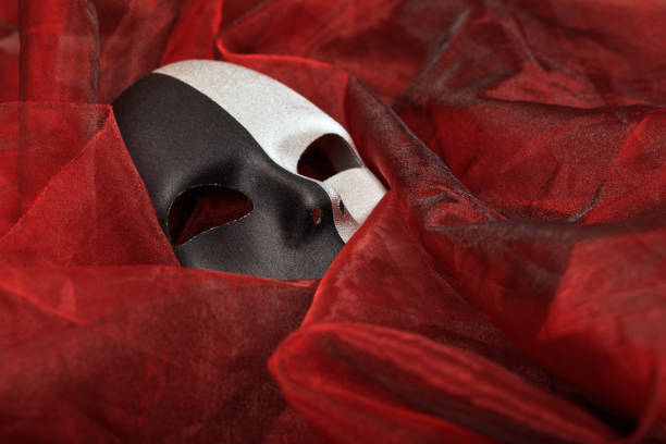 istock Carnival mask isolated on red textile background 1030323214