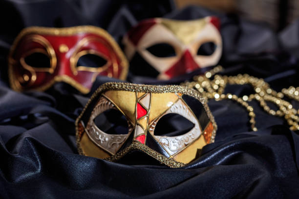 istock Carnival masks on black satin background 1030323236