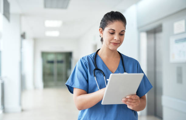 istock Managing her patient files online 1030323686