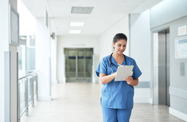 istock Her tablet helps her keep track of every single patient 1030323696
