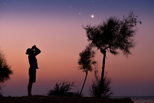 A man observing the night sky.