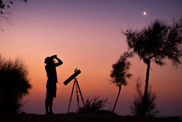A man observing the night sky.