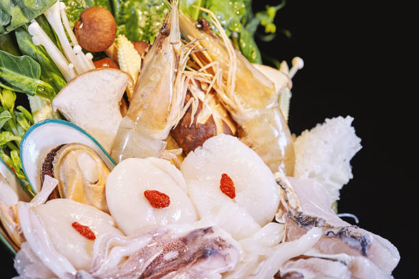 Mixed of fresh raw seafood with vegetable, Seafood raw set ready to serve, Close-up