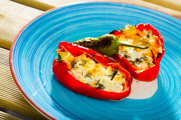 istock Appetizer sweet red peppers stuffed with soft cheese  brynza 1030332384
