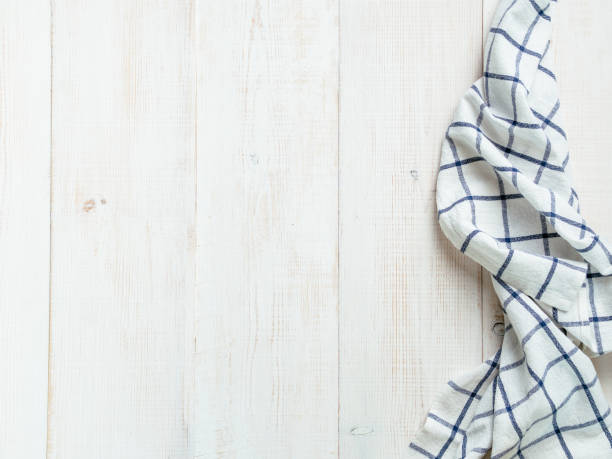 istock Blue tablecloth on white wooden table 1030333646