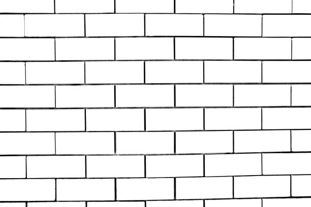 Abstract weathered modern white bricks wall background stucco in rural room . The brick work from stone tile which its was from modern paint technology.