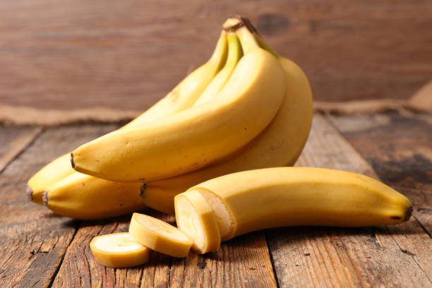 istock banana on wood background 1030334578