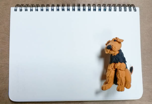 istock Blank note with cute clay dog for putting your massages in. 1030343948