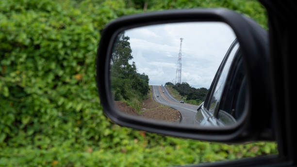 istock Rear car mirror. reflection of the sky, clouds 1030349642