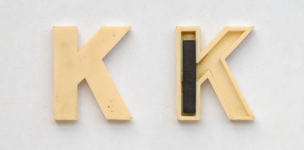 istock bright plastic cyrillic letters with magnet on white paper 1030353510