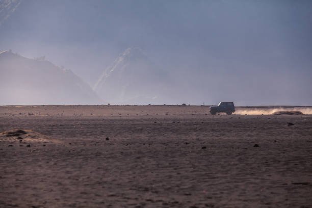 istock Car service for tourist on desert at Bromo Mountain 1030354310