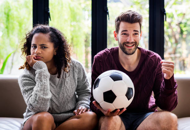 istock Couple watching a football game 1030354994