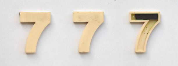 istock bright plastic numbers with magnet on white paper 1030358612