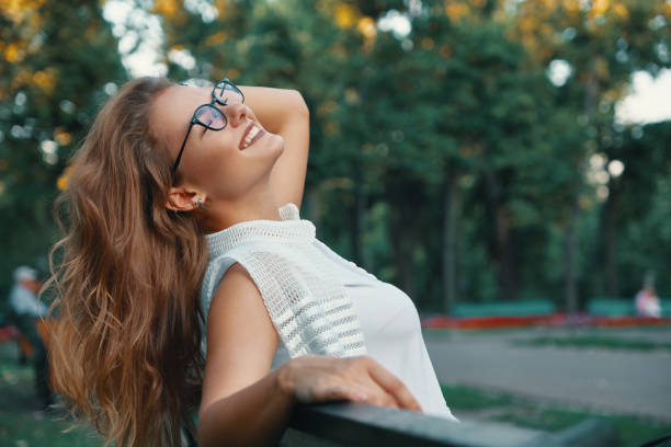 istock Positive woman having a break from city noise and work while bre 1030361438