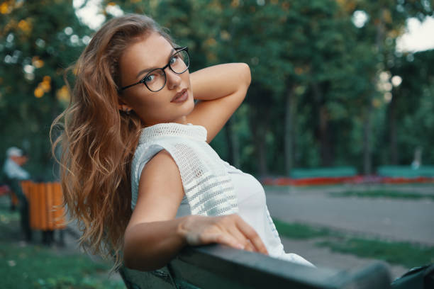 istock Positive woman having a break from city noise and work while bre 1030361504