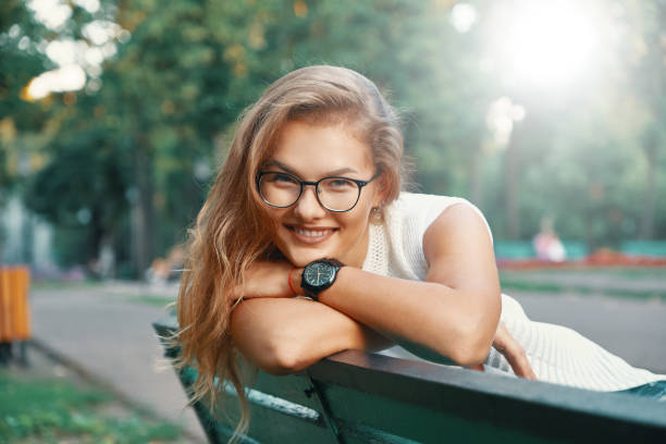istock Positive woman having a break from city noise and work while bre 1030361512