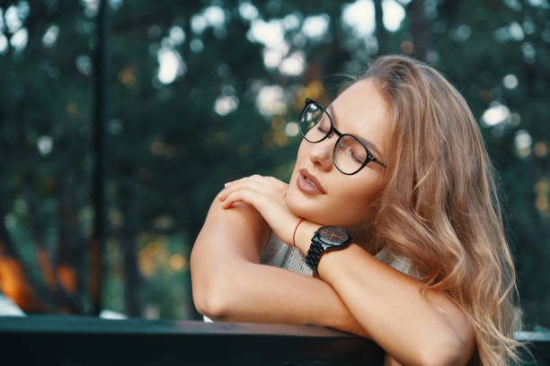 istock Positive woman having a break from city noise and work while bre 1030361516
