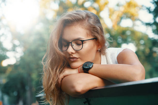 istock Positive woman having a break from city noise and work while bre 1030361618