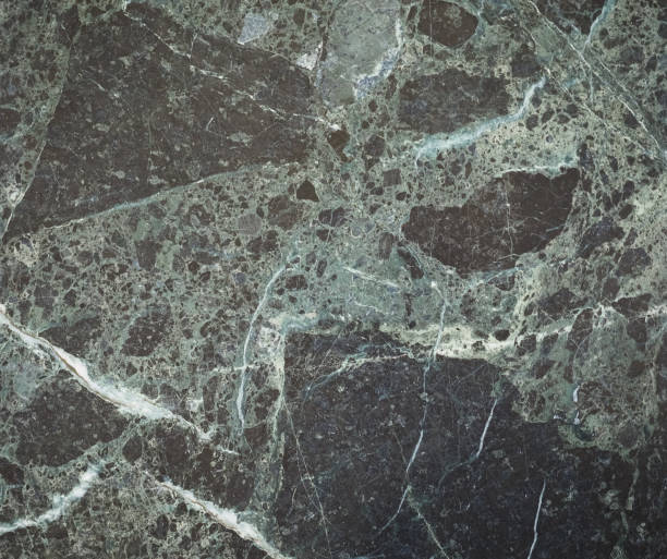 istock glossy green and black marble texture background 1030361986
