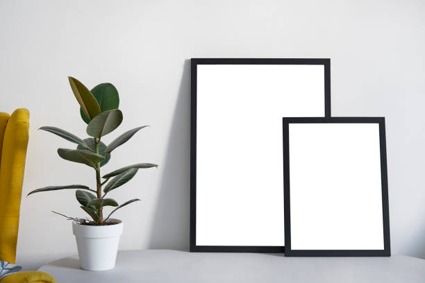 istock Two Posters in different sizes in black frame in nordic stylish modern interior, ficus, living room. Empty space for design layout. 1030363362