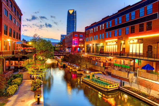Bricktown, Oklahoma City Evening view of the  Bricktown Canal in Oklahoma City. Bricktown is an entertainment district just east of downtown Oklahoma City, Oklahoma oklahoma stock pictures, royalty-free photos & images