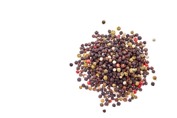 istock Top view on black, red and white peppercorns isolated on white background, shallow depth of field. 1030374288