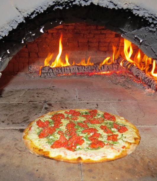 istock baked pizza in the wood oven 1030375248