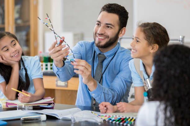 istock Confident STEM school teacher talks about DNA 1030375404