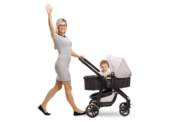 Close up shot of an anonymous woman pushing a stroller while on a walk in the park.