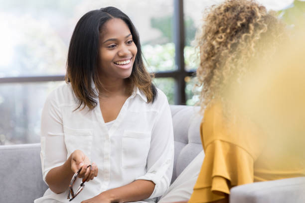 istock Beautiful woman talking with friend 1030376440