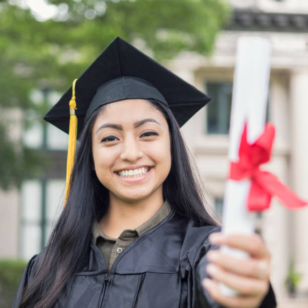 istock Attractive female college graduate 1030376544