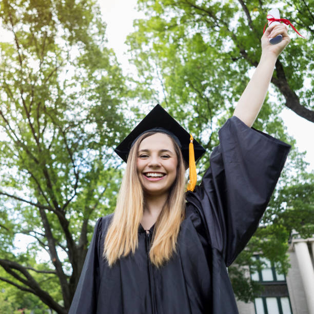 istock Ecstatic Hispanic female college grad 1030376570