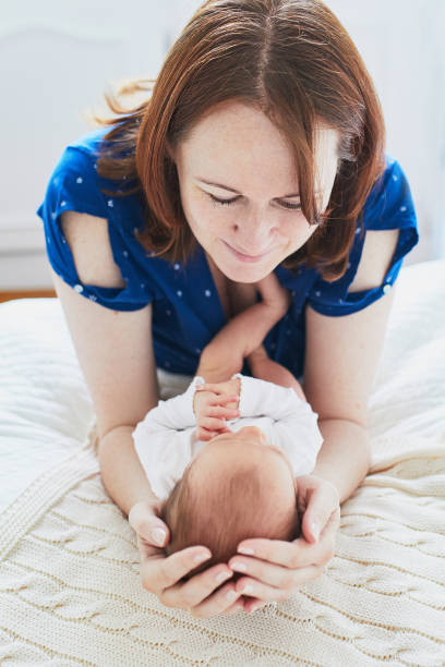 istock Mother bonding with her newborn baby 1030376754