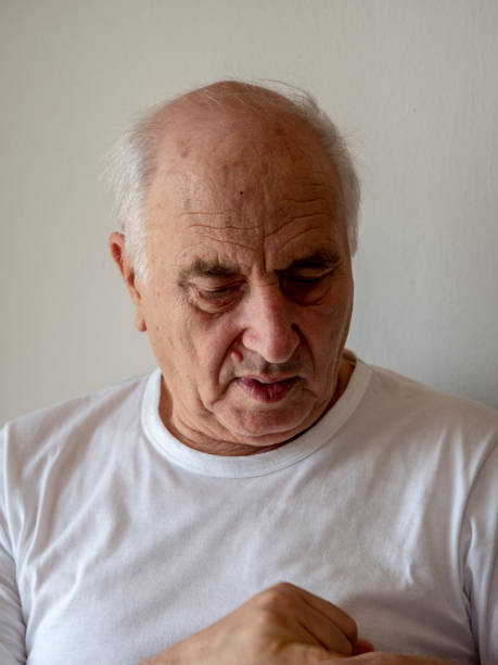 istock old man looking at camera with a serious facial expression 1030379726