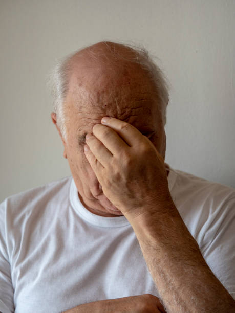 istock old man looking at camera with a serious facial expression 1030379778