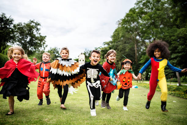 Little kids at a Halloween party stock photo