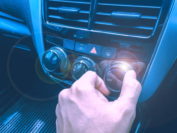istock new technology and transportation concept from interior and display control in car with human hand control audio and air flow button 1030390458
