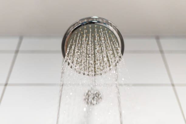 istock Shower head with refreshing cold water. Water supply is turned on 1030390486