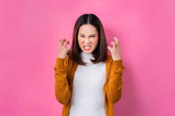 Photo of Asian woman are very angry.concept in studio