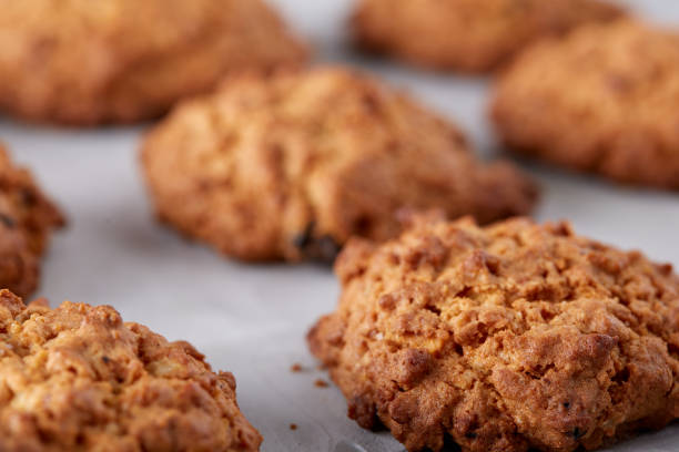 istock Sweet biscuits arranged in pattern on light textured background, close-up, shallow depth of field, selective focus. 1030398506