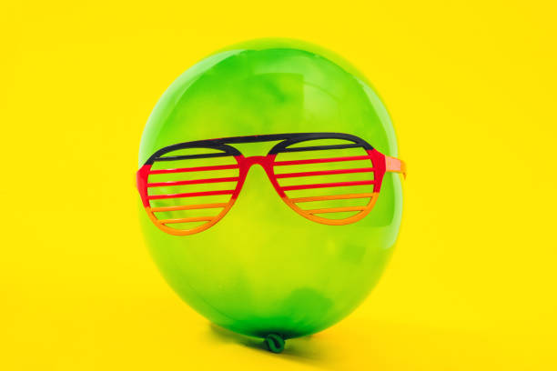 istock Green ballon with fun eyewear 1030399760