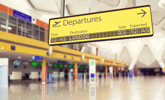 Concept of an airport departures board going to London