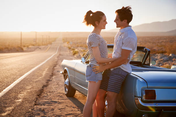 istock Romantic Couple Enjoying Road Trip In Classic Car 1030405772