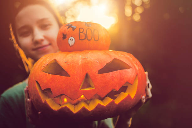istock Women holding pumpkins 1030408696