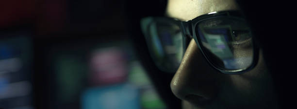 istock Nerd hacker with glasses in the dark 1030418650