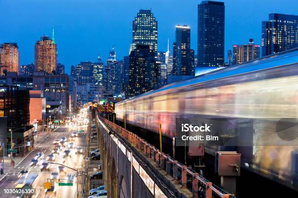 Subway Train Approaching Elevated Subway Station In Queens New York Stock Photo - Download Image Now