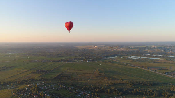 istock Hot air balloon shape heart in sky 1030428964