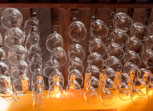 istock Many Differnt Size of Drinking Glasses Handing from Bar's Rack 1030429774