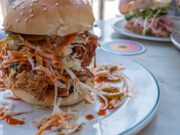 istock Close Up of Large and Tall Fried Chicken Sandwitch 1030429956
