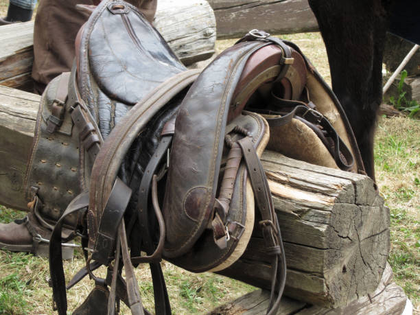 istock Leather saddle horse on a barrier in the stable 1030434556